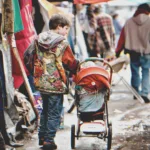 I Met a Lonely Little Boy with a Baby in Stroller Buying Clothes on the Flea Market – I Decided to Follow Him